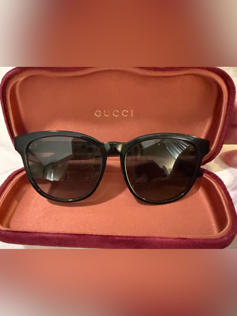 Gucci Black Frame Sunglasses with Dark Lenses